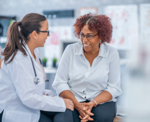 Dr and patient talking while smiling